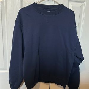 Long sleeved, navy blue, red and green sweater. They’re $8 for each.